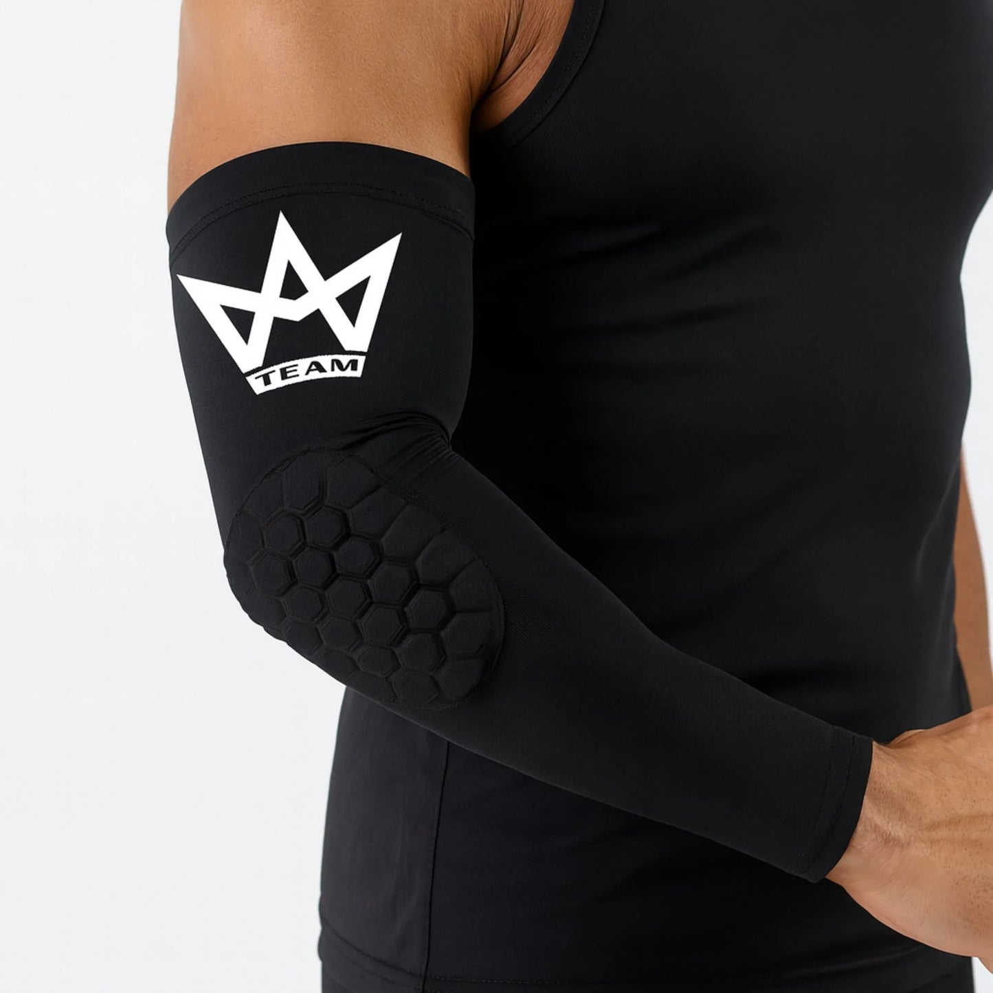 Black compression arm sleeve with hexagonal elbow padding and white TEAM logo for athletic performance