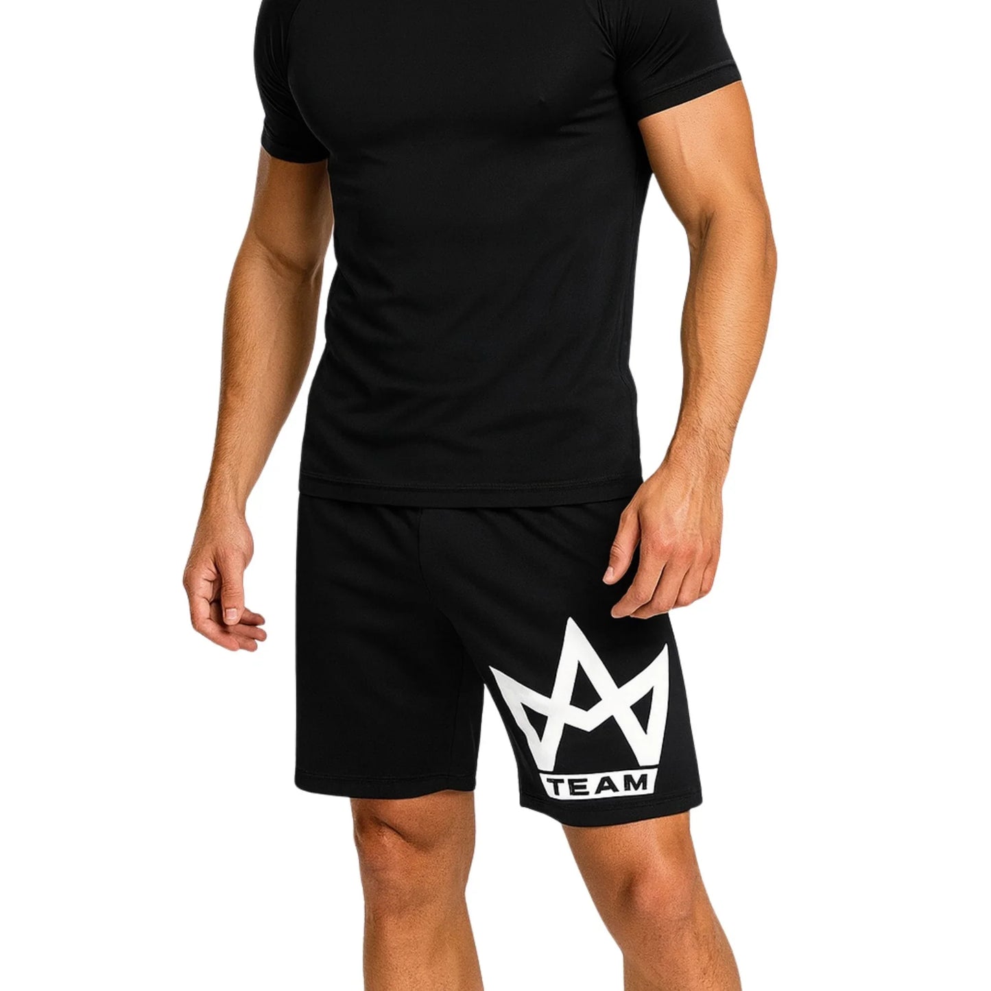 Black athletic shorts with white crown logo and 'TEAM' text, worn with matching compression top for gym or sports.