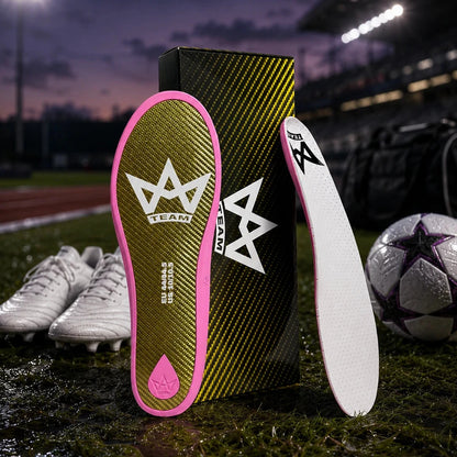 Performance insoles with pink trim and carbon fiber design, ideal for athletes on soccer field